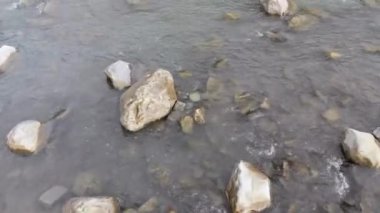 Flying over Wild Mountain River Flowing with Stone Boulders and Rapids