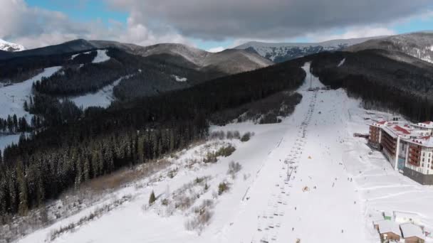 Aerial view on Lot of People Skiing on Ski Slopes near Ski Lifts on Ski Resort — Stock Video