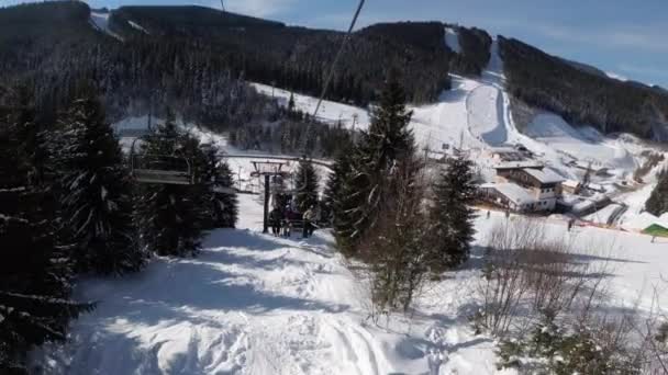 POV from Ski Chair Lift to Snowy Ski Slope, Skiers Slide on Ski Slope.Ski Resort — Stock Video