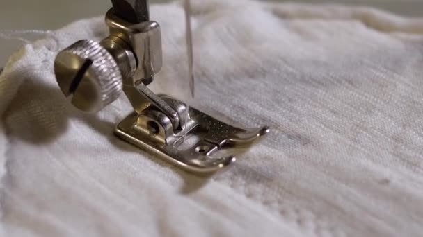 Sewing Machine Needle in Slow Motion. A Tailor Sews Homemade Face Mask of Fabric — Stock Video