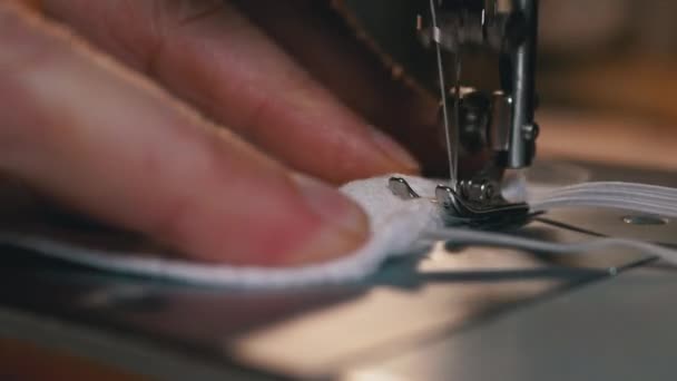 Tailor at Sewing Machine Sews a Homemade Medical Face Mask to Protect Covid-19 — Stock Video