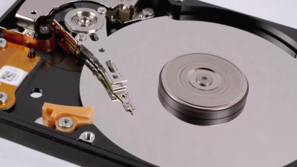 Opened Hard Disk Drive with Spinning Platter. Move of Writing Magnetic Head — Stock Video