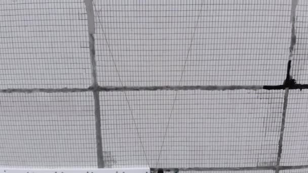 Aerial View on Industrial Climber Suspended on Ropes Performs Work on Insulation of Facade of High-rise Building using Styrofoam — Stock Video