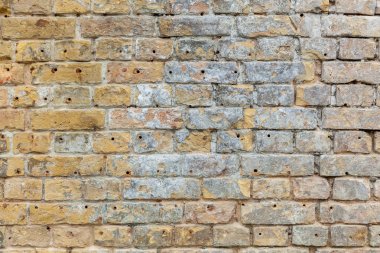Tuğla duvar. Tuğla duvar tuğla farklı boyutlarda ve şekillerle renkleri gri ve kum.