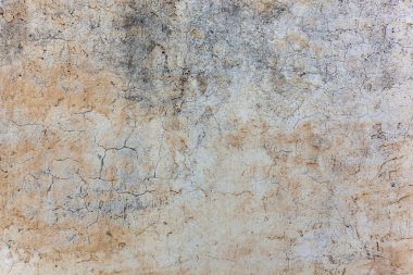 Soyut duvar. Çatlaklar ile sarı-gri arka plan eski dokulu beton duvar. 