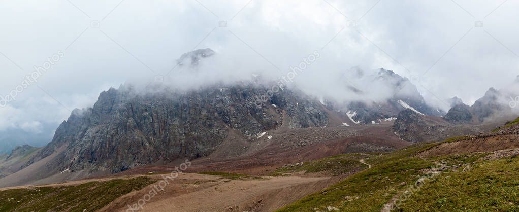 Kazakhstan mountains. Cloudy mountains of Medeu in Kazakhstan, 