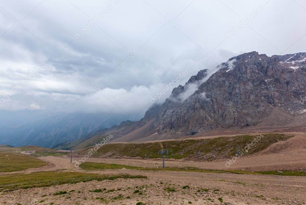 Kazakhstan mountains. Cloudy mountains of Medeu in Kazakhstan, Shymbulak.