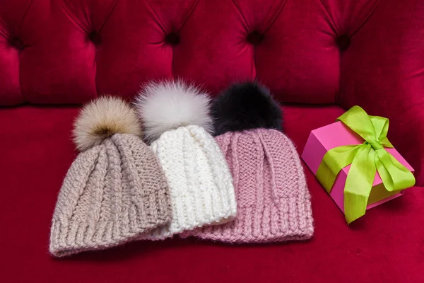 Winter Knitted Hats Fur Ball Lay Red Couch Knitted Hats — Stock Photo, Image