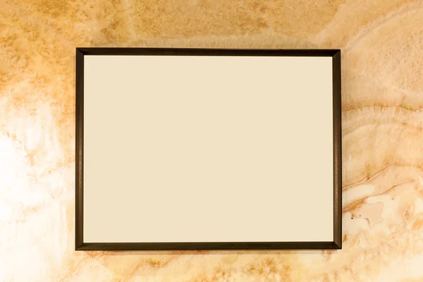 Blank photo frames on wall.Aged wall texture with blank photo frame