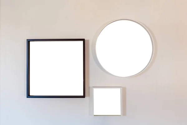 Blank template frame set hanging on the wall — Stock Photo, Image