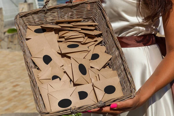 girl holding a basket with envelopes. basket with envelopes