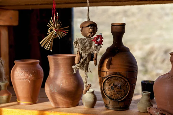 Handmade clay jugs on the counter — Stock Photo, Image