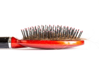 Tarak saç tufts, saç demeti, çok kıl saç fırçası üzerinde beyaz bir arka plan üzerinde kapat