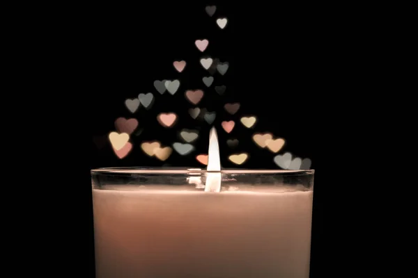 Candle with  bokeh hearts background rising soaring up. Vintage style. — Stock Photo, Image