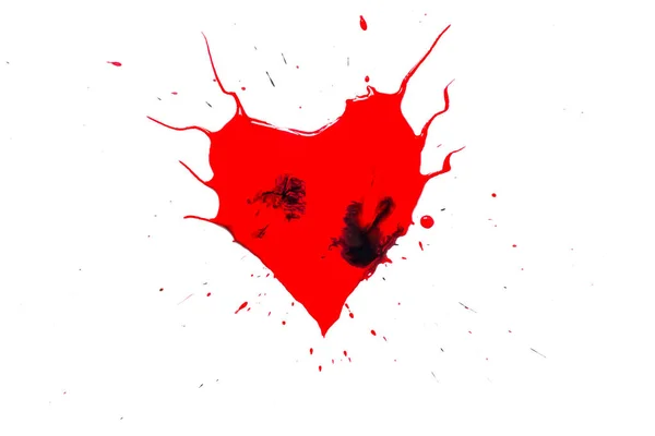 Heart symbol painted with red paint with horns and black drops and spatter and splash around isolated on white background — Stock Photo, Image