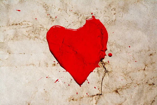 Heart symbol painted with red paint with splashes around on vintage background. Old retro style photo with cracks crumpled paper. Postcard style. — Stock Photo, Image