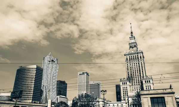 Panorama of Warsaw with modern skyscrapers on a sunny day overlooking the Palace of Culture. Old retro vintage style photo. — Stock Photo, Image