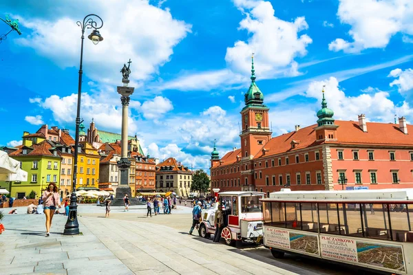 Warsaw, Poland  July 14, 2017: Plac Zamkowy - The castle square in Warsaw is located between the Warsaw royal palace and the Warsaw Old Town. Sunny summer day. Horizontal photo. Stock Photo