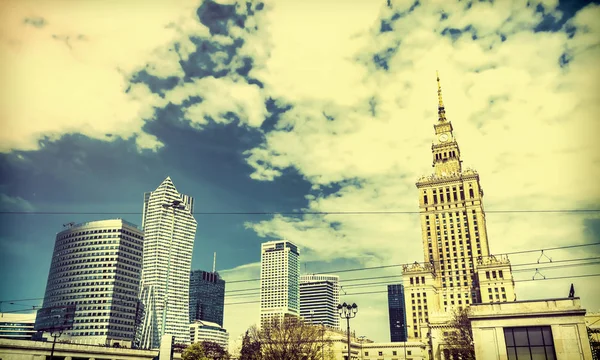 Panorama of Warsaw with modern skyscrapers on a sunny day overlooking the Palace of Culture.  Old retro vintage style photo. — Stock Photo, Image
