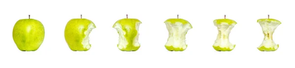 Green apple, a bitten off from different sides, a stub of a green apple isolated on a white background. Stages of eating an apple. — Stock Photo, Image