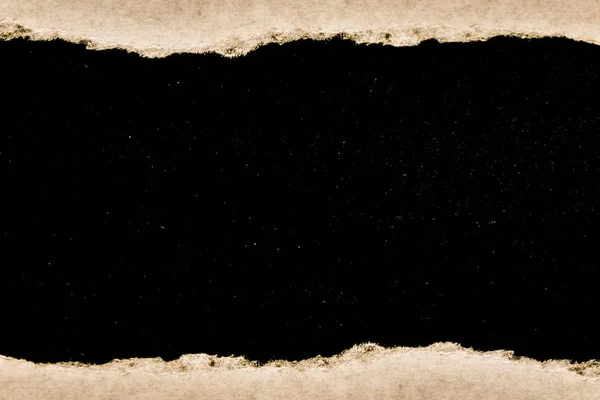 A hole in vintage paper with torn edges close-up with a black background inside with colorful space stars in the universe. A hole in paper with a view of the cosmos of the universe. — Stock Photo, Image