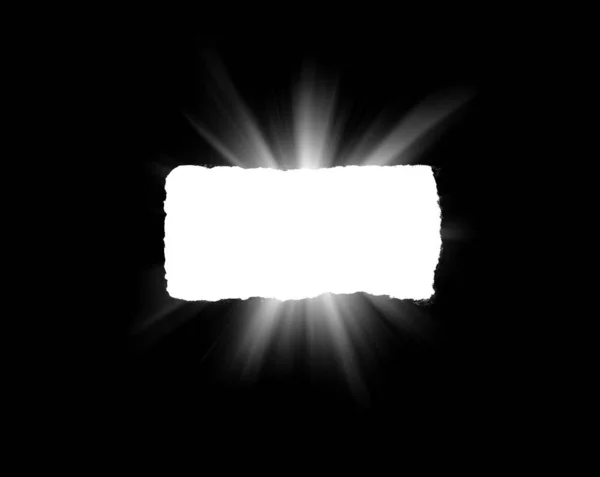 An isolated hole in black paper with torn edges and piercing sunlight and rays through it. Sunlight breaking through the darkness from a hole. — Stock Photo, Image