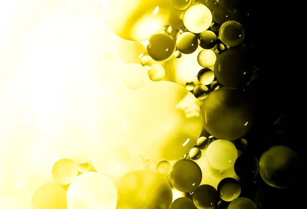 Δημιουργικό φόντο αφαίρεσης από κύκλους διαφορετικών μεγεθών με οπίσθιο φωτισμό και κλίση σε χρυσό κίτρινο χρώμα. — Φωτογραφία Αρχείου