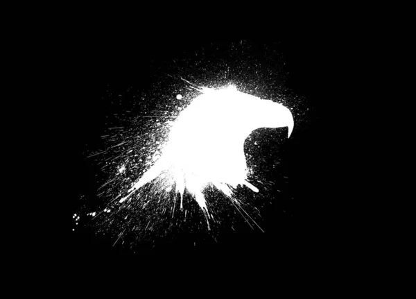 Eagle Head Silhouette with paint splashes, splatters and blots isolated on a black background.