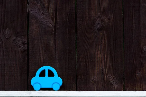 Auto na dřevěné pozadí — Stock fotografie