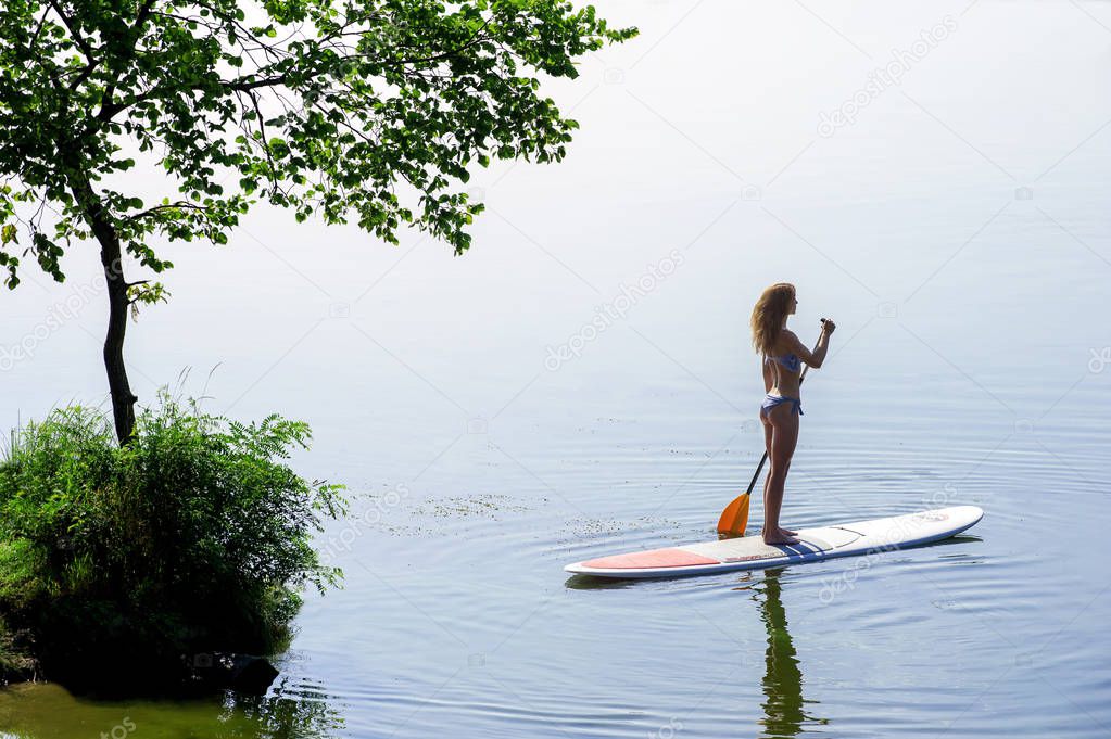 beautiful girl on SUP board