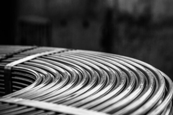 Roll of metallurgical cored wire close up. black and white photograph