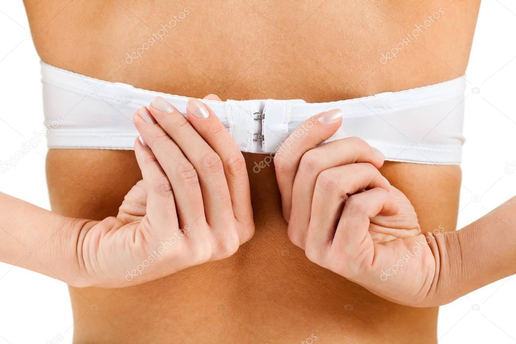 Woman clasping bra