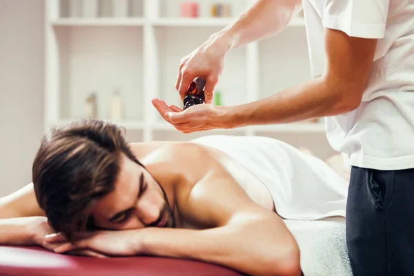 Young Man Enjoying Massage Spa Treatment — Stock Photo, Image