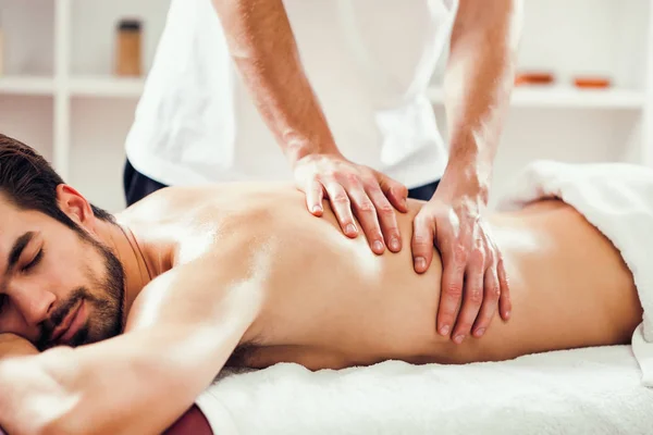 Young Man Enjoying Massage Spa Treatment — Stock Photo, Image