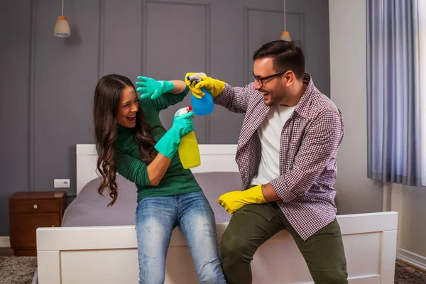 Young Happy Couple Having Fun While Cleaning Apartment — 스톡 사진