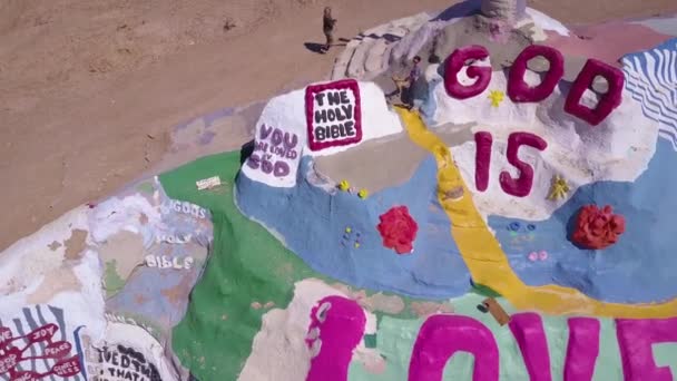 Aerial Giant Hippy Christian Art Installation Honors Jesus Desert Slab — Stock Video
