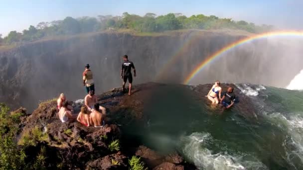 Tourists Gather Devil Pool Edge Victoria Falls Zambia Glimpse Edge — Stock Video