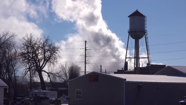 Industrial Town Factory Smoke Pours Forth Water Tower — Stock Video