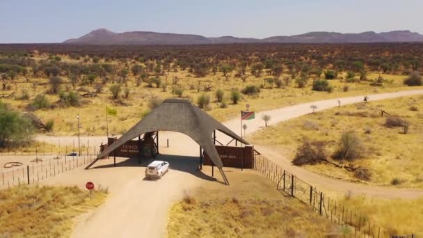 Aerial Safari Truck Vehicle Arriving Main Gate Erindi Reserve Fenced — Stock Video