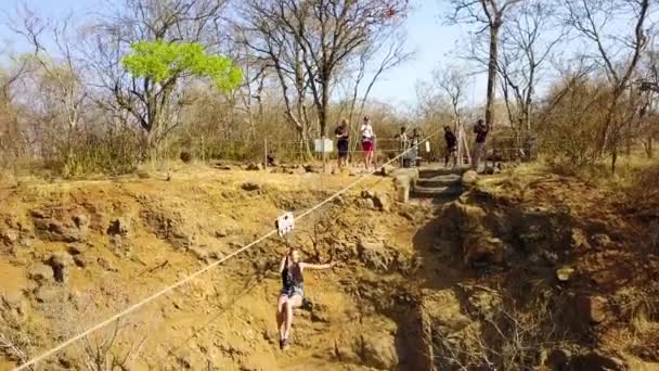 Aerial Woman Ziplining Canyon Victoria Falls Bridge Background Zimbabwe Zambia — Video Stock