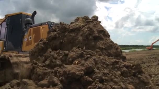 Bulldozer Pushes Fresh Mounds Earth — Stock Video