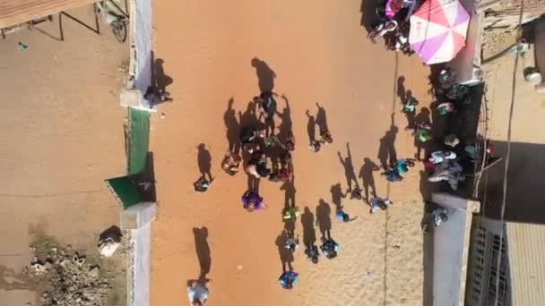 Children Wave Drone Takes Them Dirt Road West Africa — Stock Video