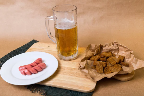 Fresh beer with bread toast — Stock Photo, Image