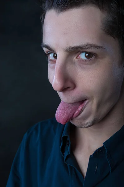 Young man silly faces portrait — Stock Photo, Image