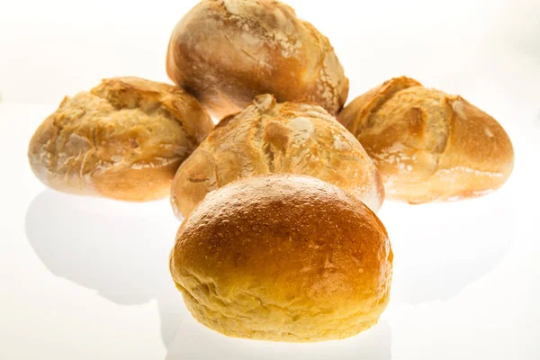 One sweet bread and four small normal bread — Stock Photo, Image