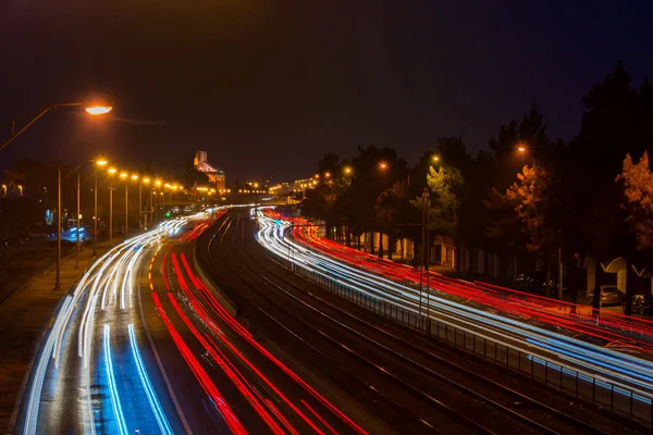 Car light trails in lisbon by night — Stock Photo, Image