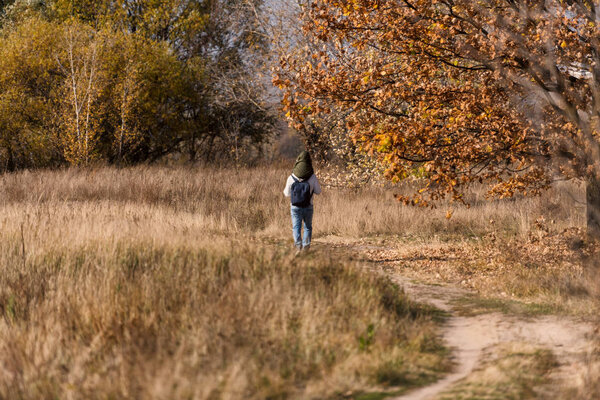 Father an son walking in the park in Kiev, Ukraine.