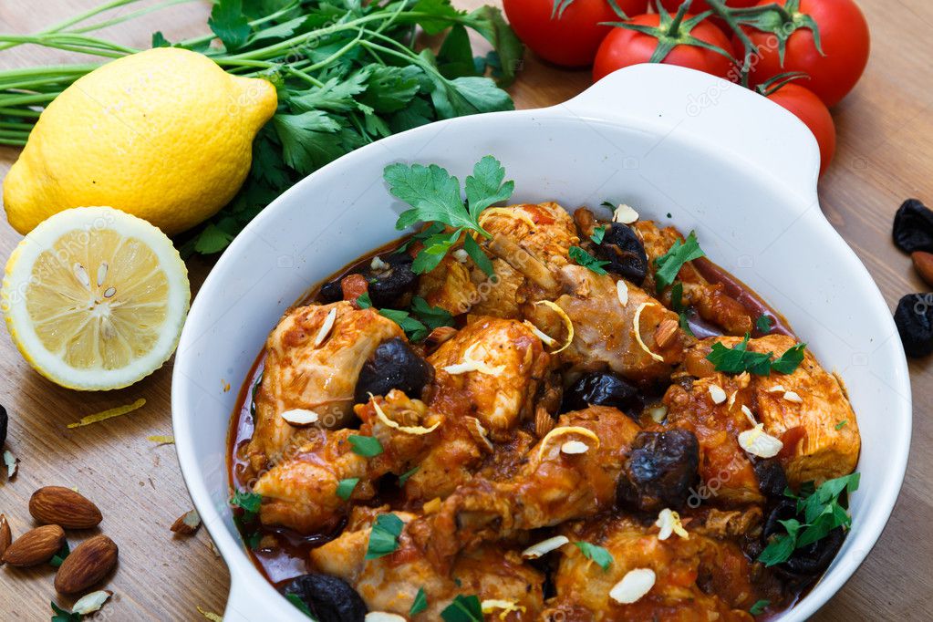 Meal of chicken tagine stew in a spicy, nutty tomato sauce and prunes