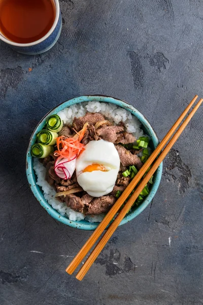 Gyudon - japanese rice and beef bowl on dark background — Stock Photo, Image