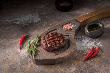 Fillet mignon steak on wooden board, copy space clipart